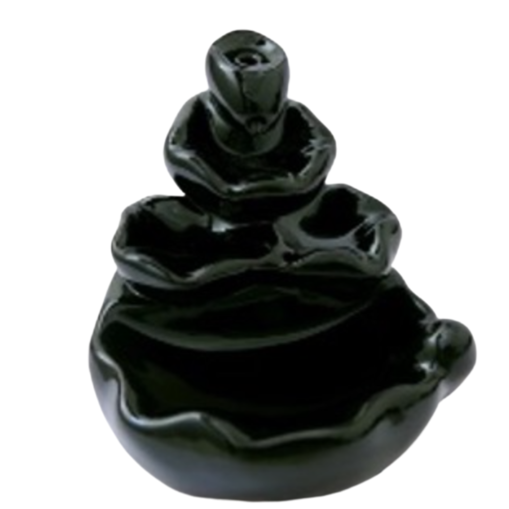 Tiered ceramic Waterfall Backflow Incense Burner creating a tranquil smoke waterfall—used for meditation, ritual, and ambient calm.