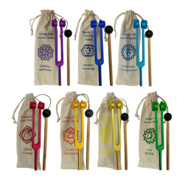 Set of seven color-coded chakra tuning forks with bags