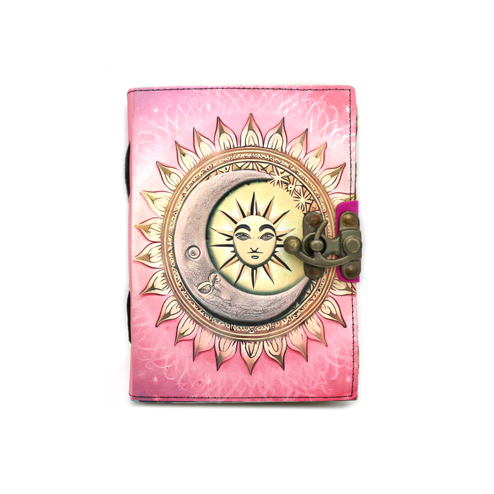 Pink leather celestial spell journal with sun and moon design and brass latch
