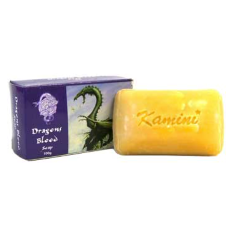 Yellow bar of soap with 'Kamini' branding next to a purple packaging box featuring a dragon illustration.