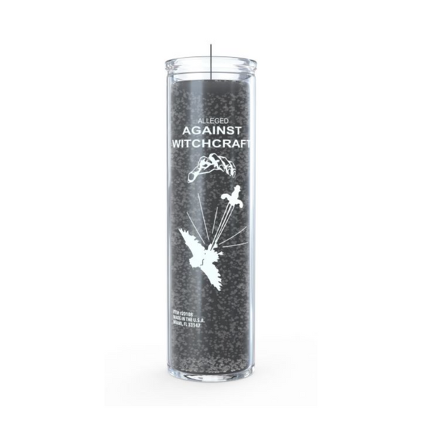 A cylindrical black, magic ritual candle with 'Against Witchcraft' text and a graphic design featuring a bird and a pentagram.