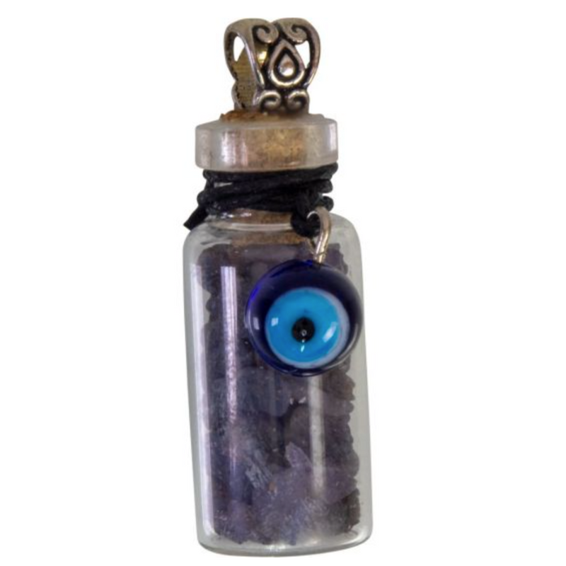 Miniature glass bottle pendant filled with sapphire chips, adorned with an evil eye charm, symbolizing protection and intuition.