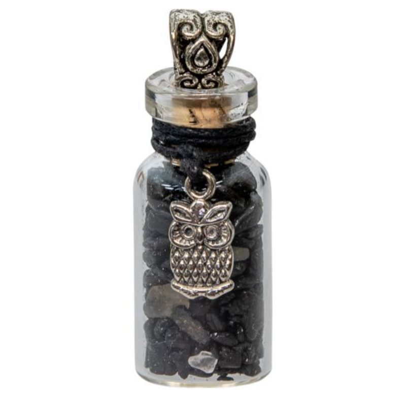 Miniature glass bottle pendant filled with black tourmaline chips, adorned with an owl charm, symbolizing protection and wisdom.