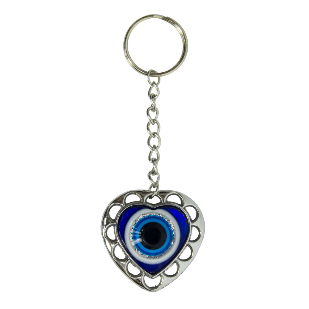 Heart-shaped keychain with an eye design on a white background. Puffed Heart Evil Eye Glass Talisman with blue glass heart design, symbolizing love, protection, and harmony.