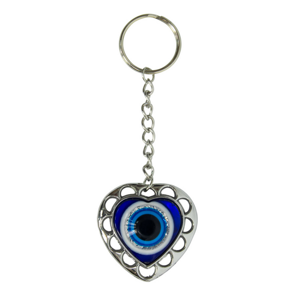 Heart-shaped keychain with an eye design on a white background. Puffed Heart Evil Eye Glass Talisman with blue glass heart design, symbolizing love, protection, and harmony.