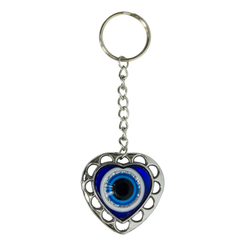 Heart-shaped keychain with an eye design on a white background. Puffed Heart Evil Eye Glass Talisman with blue glass heart design, symbolizing love, protection, and harmony.