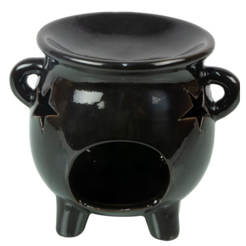 Starry Cauldron Ceramic Oil Burner with star cutouts, used for essential oils or wax melts to inspire magic, transformation, and relaxation.