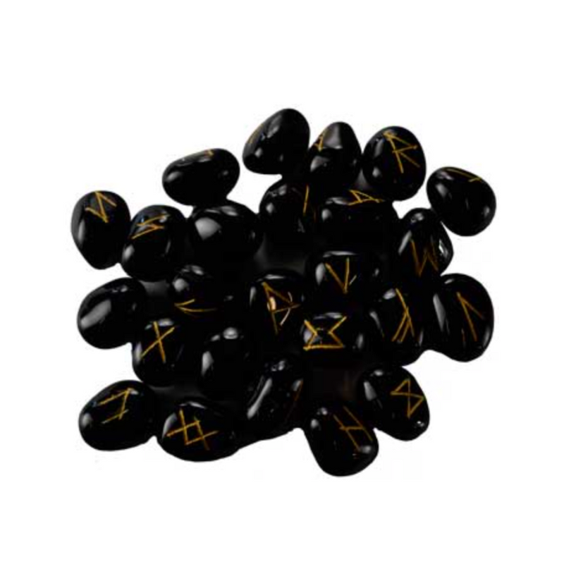 Black stones with gold runes on a white background