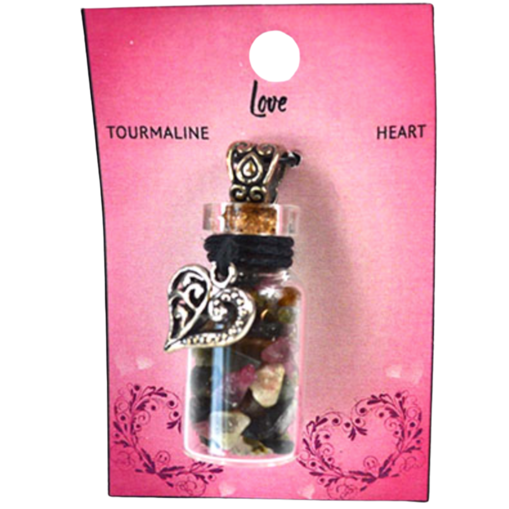 Heart-shaped pendant in a glass bottle on a pink card with 'Love Tourmaline Heart' text.