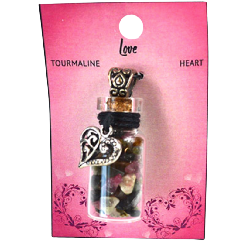 Heart-shaped pendant in a glass bottle on a pink card with 'Love Tourmaline Heart' text.